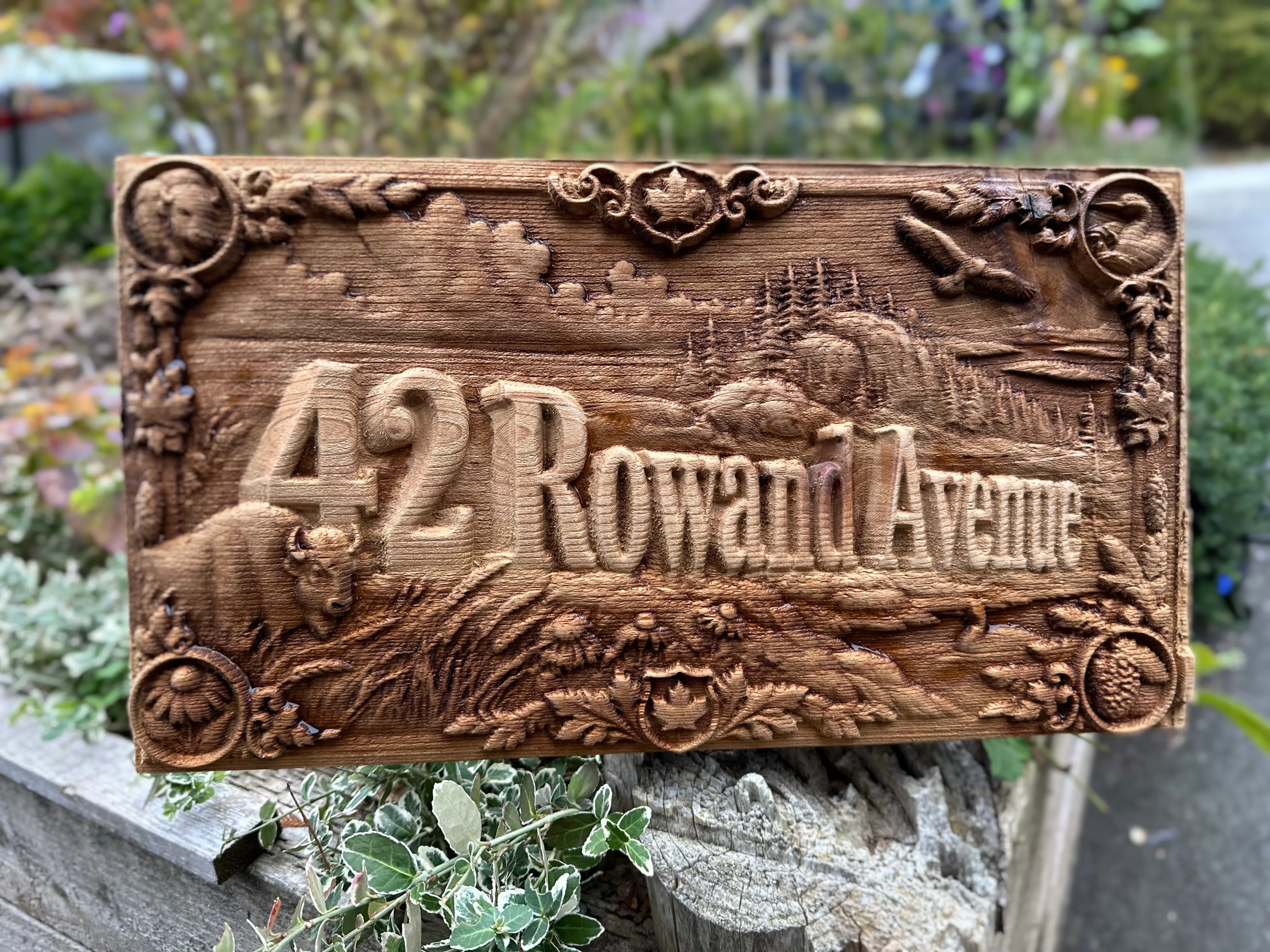 Prairie Heritage sign with a bison and maple leaves